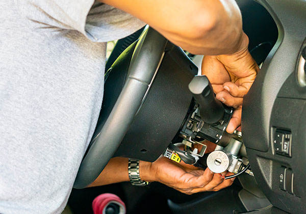locksmith working on a car ignition